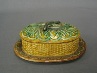 A 19th Century oval Majolica sardine dish and cover, the finial in the form of a sardine (chips to lid and fins of sardines) 10"
