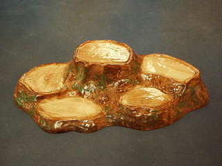 A Beswick Beatrix Potter set stand in the form of a tree stump with 5 recepticals, base marked Beswick, 12"