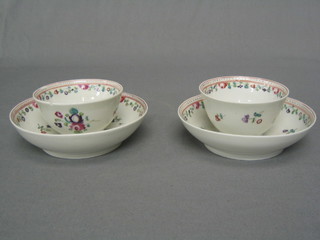 A pair of 18th Century famille vert porcelain tea bowls and saucers