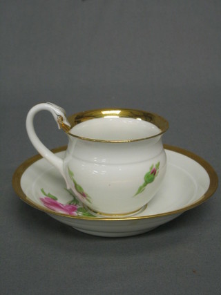 A Meissen cabinet cup and saucer of baluster form decorated roses (chip to rim and handle f), the base with cross swords marked and impressed N91