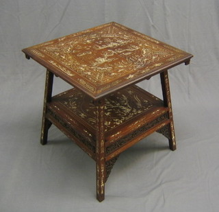 A handsome 19th Century Oriental hardwood 2 tier square occasional table, inlaid throughout, the top panel inlaid a Willow pattern scene, with pierced fret panels to the side and raised on square tapering supports 26" (crack to top)