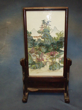 A 19th Century Canton famille rose porcelain table screen  contained in a hardwood stand 18" x 10" (crack to the centre)