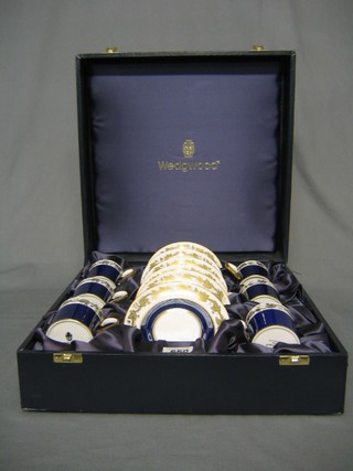 A Wedgwood 6 piece coffee service with blue and gilt banding, cased 