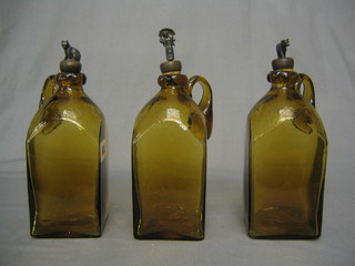 3 Victorian square green blown glass decanters marked Whisky, Gin and Rum with Victorian registration mark and metal stoppers