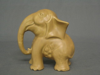 A Sylvac style brown glazed model of a standing elephant 5"