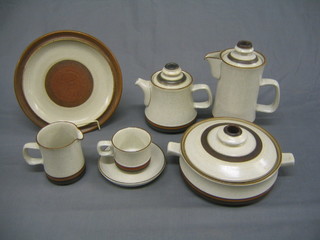 A 37 piece Denby Potters Wheel dinner service comprising 4 10" dinner plates, 1 9" salad bowl (chipped), 9 tea plates, 1 oval platter, 1 teapot, 1 sugar bowl, 2 tureens and cover, creamer, coffee pot, 8 cups and 8 saucers and 1 milk jug