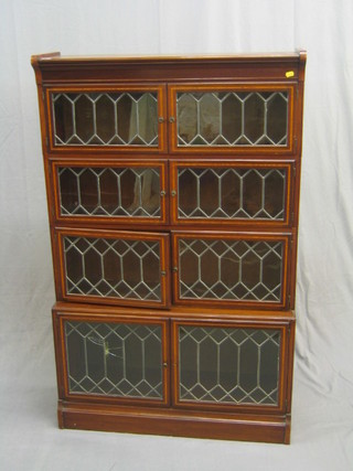 An Edwardian inlaid mahogany 4 tier Globe Wernicke style bookcase with lead glazed panelled doors, 35"