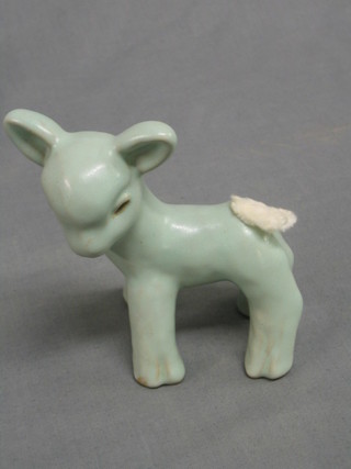 A  "Sylvac" style turquoise green glazed figure of a standing lamb 5"