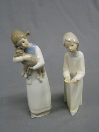 A Lladro figure of a standing girl with lamb, base impressed Lladro Made in Spain 9" (lambs ear f) together with a Lladro figure of a standing girl with out stretched hand, the base marked Lladro 8" (hands f)