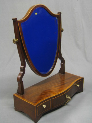 A Georgian shield shaped mahogany dressing table mirror raised on a serpentine base, fitted 1 long drawer flanked by 2 short drawers, raised on bracket feet 18" (recently restored)