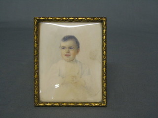 A 1920's/30's  miniature portrait on ivory of a seated child in christening gown 4" x 3" contained in a gilt metal frame