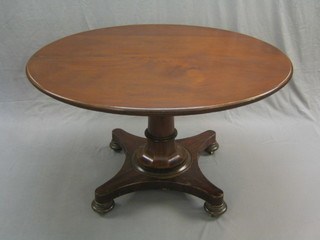 A 19th Century Continental oval snap top breakfast table raised on a circular column with triform base and bun feet (some veneer damage to base) 51"