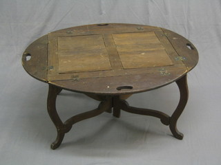 A 19th Century weathered oak butler's tray with full drop down sides raised on a folding stand 28"