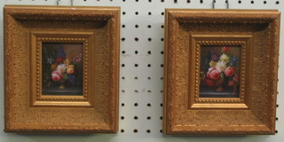 A pair of 20th Century oil paintings on board still life studies of flowers 3" x 2 1/2" contained in decorative gilt frames