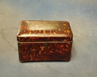 A Victorian D shaped tortoiseshell tea caddy with hinged lid and silver diamond inlay to the top, (hinges amateurly repaired with super glue!) the interior fitted 2 compartments (1 finial missing) raised on bun feet (slight chip to front right hand side) 7"