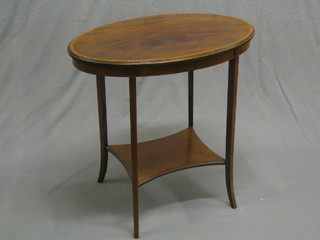 An Edwardian oval inlaid mahogany 2 tier occasional table raised on square tapering supports 27"