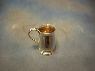 A good silver plated tankard with armorial decoration