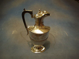A Georgian style oval hotwater jug with demi-reeded decoration