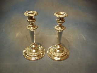 A pair of 19th Century circular silver plated candlesticks 10"