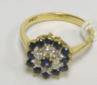 A lady's attractive gold dress ring set sapphires and diamonds