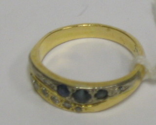A lady's 18ct gold dress ring set sapphires and diamonds