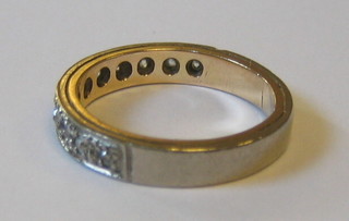 A lady's 18ct half eternity ring set 11 diamonds