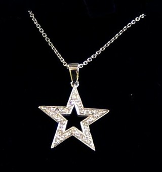 A white gold pendant in the form of a 5 pointed star set numerous diamonds