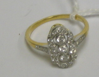 A lady's 18ct gold dress ring set 3 diamonds to the centre, the shoulders set 6 diamonds