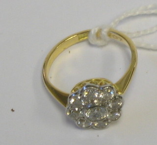 A lady's 18ct gold floral design dress ring  set 9 diamonds (approx 1.0ct)