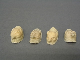 4 carved ivory figures in the form of foxes heads