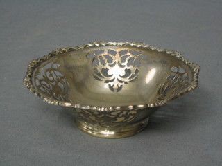A circular pierced silver plated bon bon dish raised on a circular spreading foot, Sheffield 1940 by Walker & Hall, 2 ozs