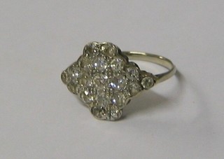 A lady's 18ct white gold dress ring set numerous diamonds