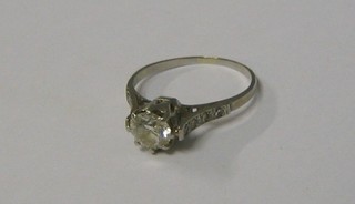 A lady's 18ct white gold or platinum set solitaire diamond engagement ring with 8 diamonds to the shoulders