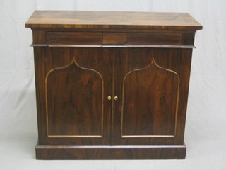 A William IV rosewood chiffonier fitted a drawer, the interior fitted a shelf and enclosed by Gothic style arch shaped drawers, raised on a platform base (missing shelved back and columns, recently restored) 39"