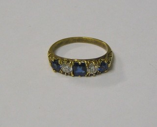 A lady's 18ct yellow gold dress ring set 2 diamonds and 3 sapphires (approx 0.40ct)