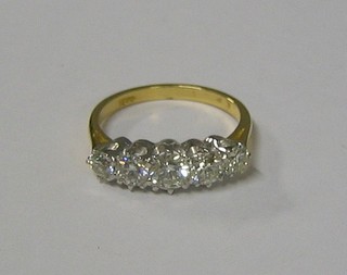 A lady's attractive 18ct gold engagement/dress ring set 5 diamonds (approx 1.43ct)