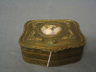 A 19th Century gilt metal trinket box of shaped form with hinged lid, the lid inset a print of a bonnetted lady 4"