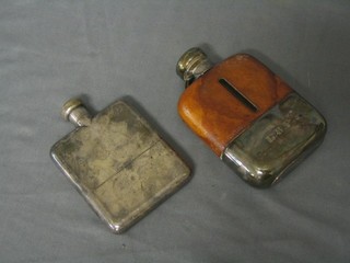 A glass hip flask with plated mounts and a silver plated hip flask
