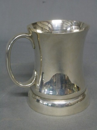 A waisted silver half pint tankard marked "The Gaiety"