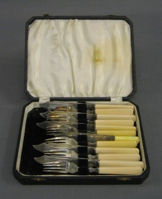 A set of 6 silver plated fish knives and forks, cased
