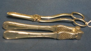 A pair of silver plated grape scissors and a pair of silver plated nut crackers