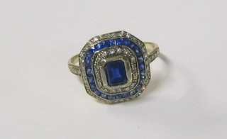 A lady's very attractive sapphire and diamond set dress ring