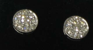 A pair of circular diamond set earrings (approx 0.70ct)