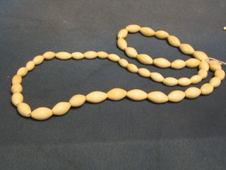A string of ivory beads