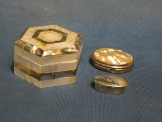 A 20th Century octagonal mother of pearl trinket box with hinged lid 3", an oval ditto purse and a small pill box