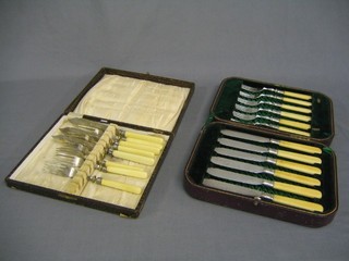 A set of 6 silver plated fish knives and forks and 1 other set