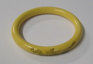 An Eastern ivory bangle carved a tiger