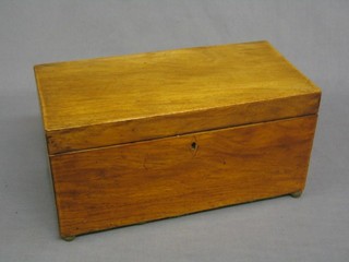 A 19th Century bleached mahogany twin compartment tea caddy with hinged lid, raised on brass bun feet, 12" (no bowl)