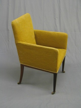 An Edwardian mahogany framed tub back chair upholstered in yellow material