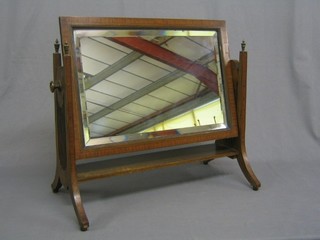 An Edwardian rectangular bevelled plate dressing table mirror contained in an inlaid mahogany frame 20"